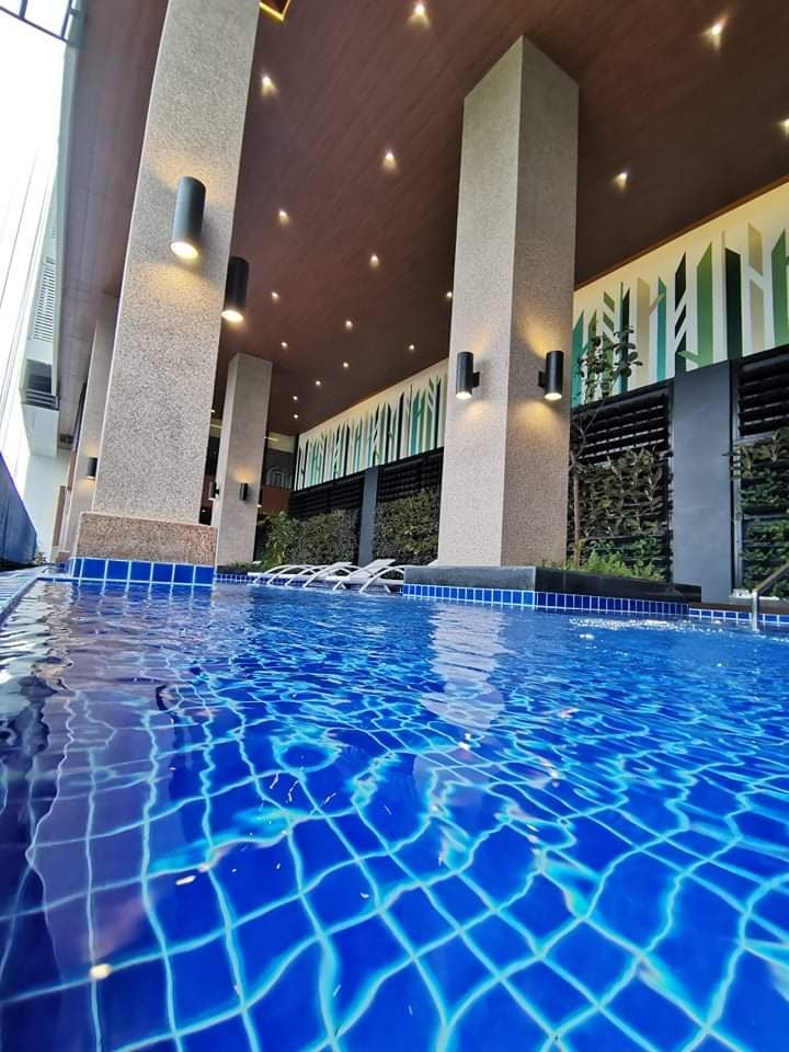 Close view of blue mosaic tiling at a pool waterline